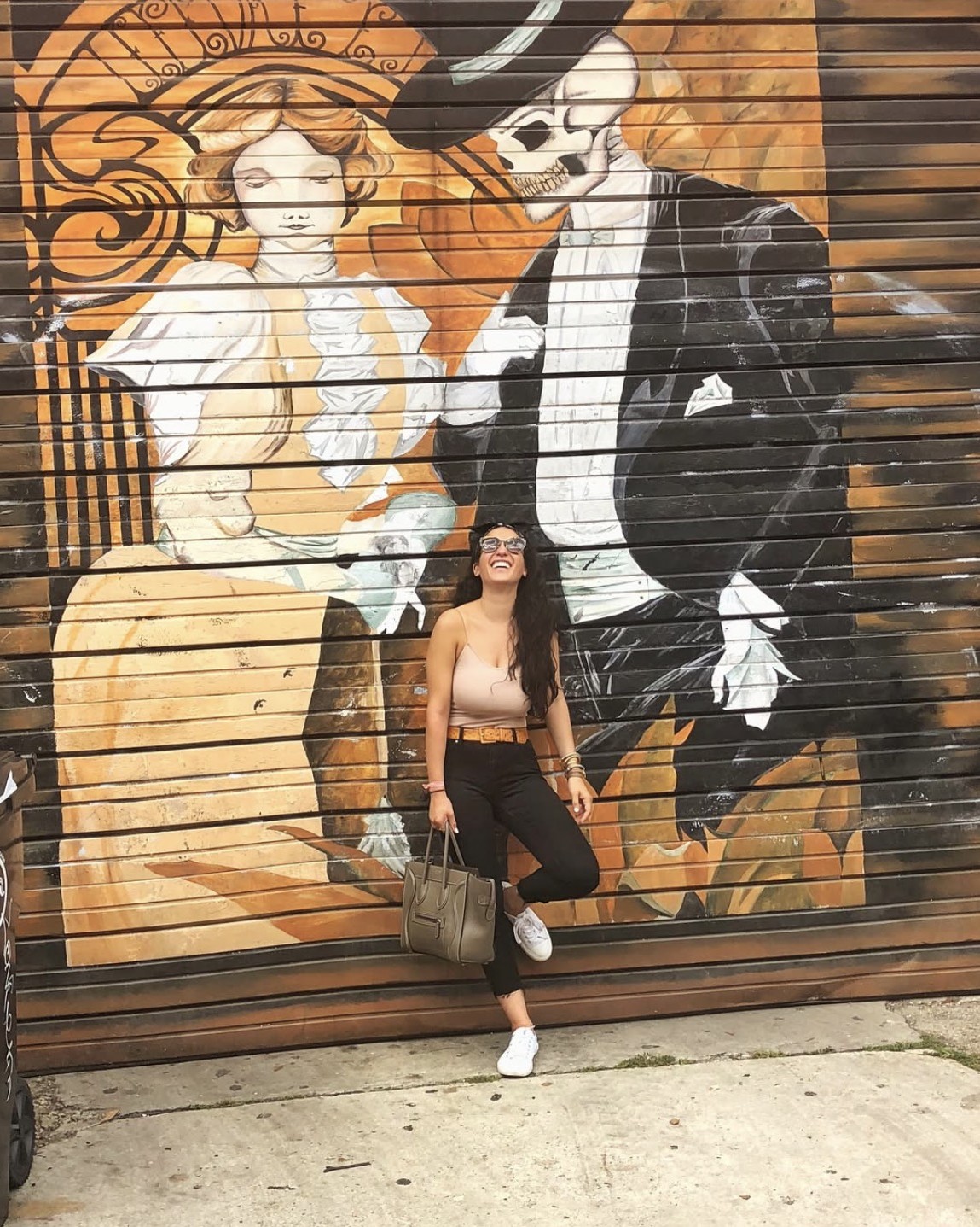 Sam in front of a mural, off-duty